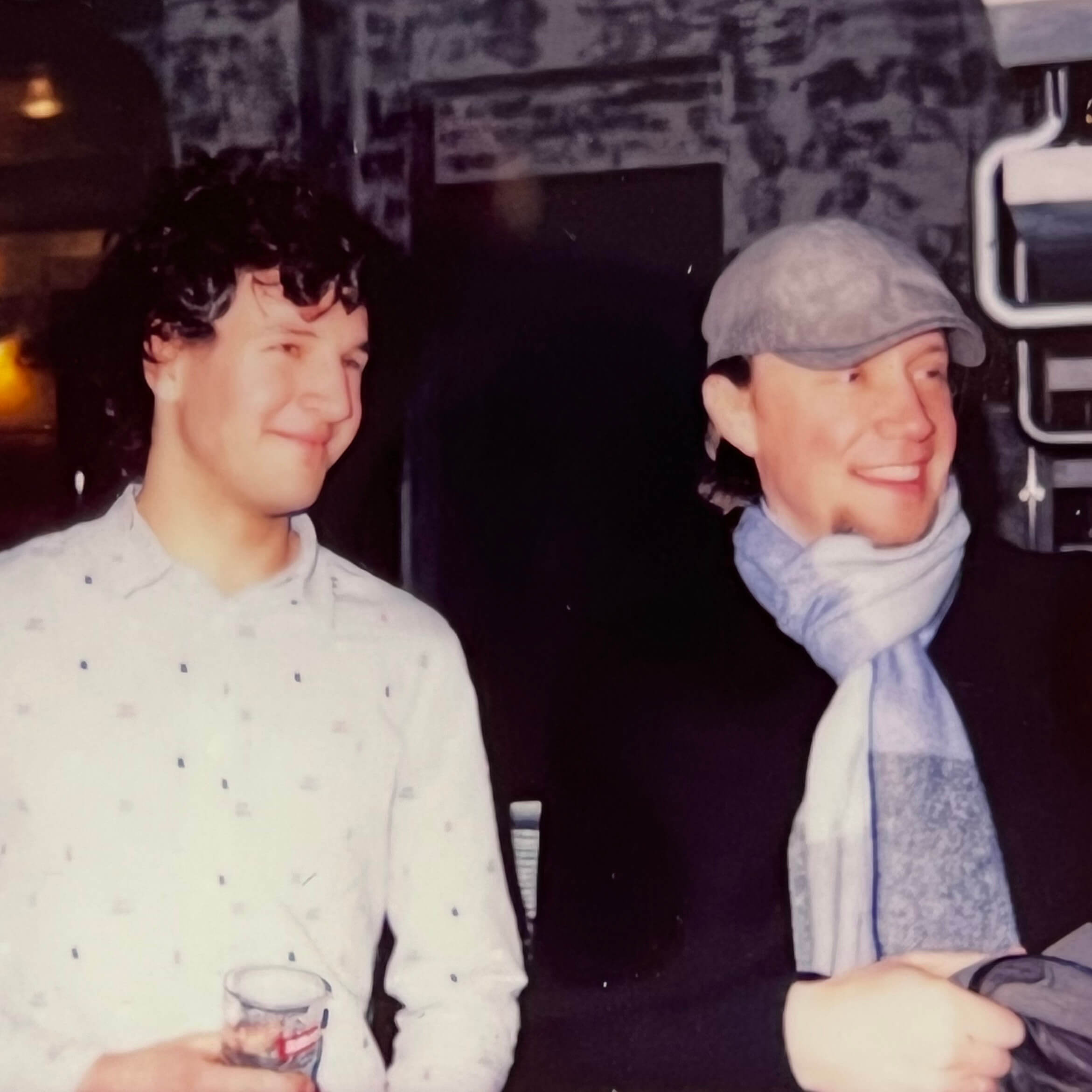 Two Keen employees smiling and looking into the distance